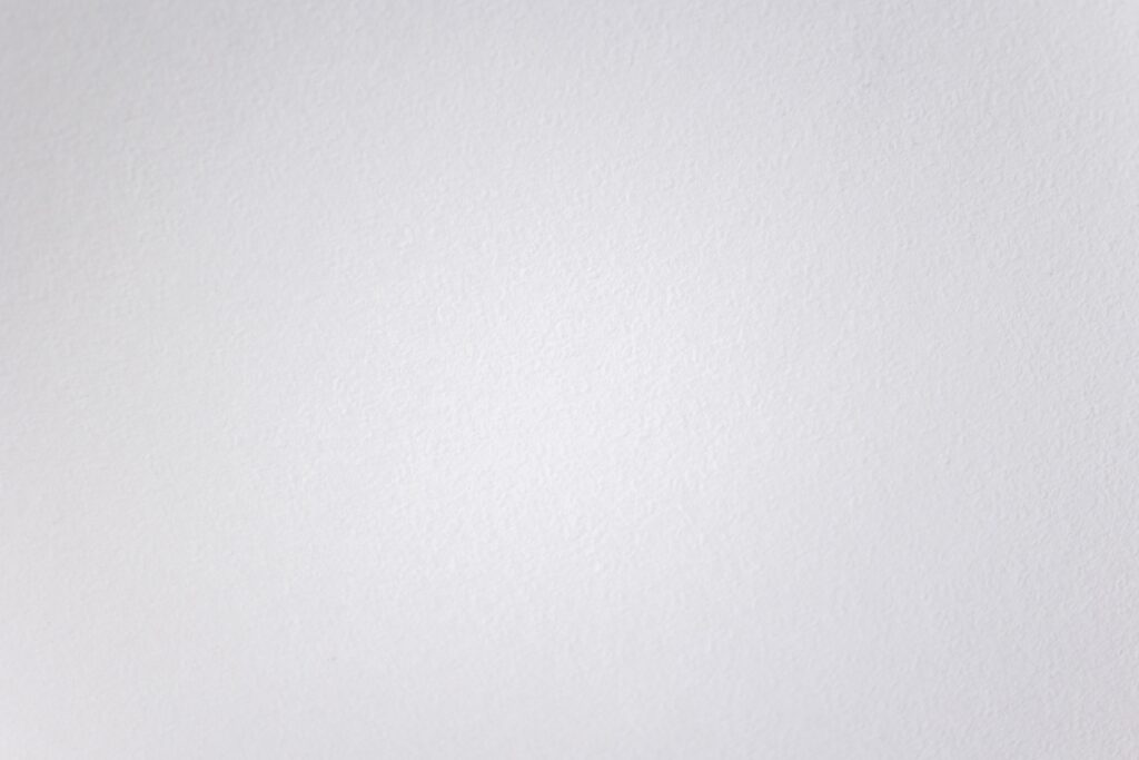 Subtle texture of a clean white wall, perfect for minimal designs.